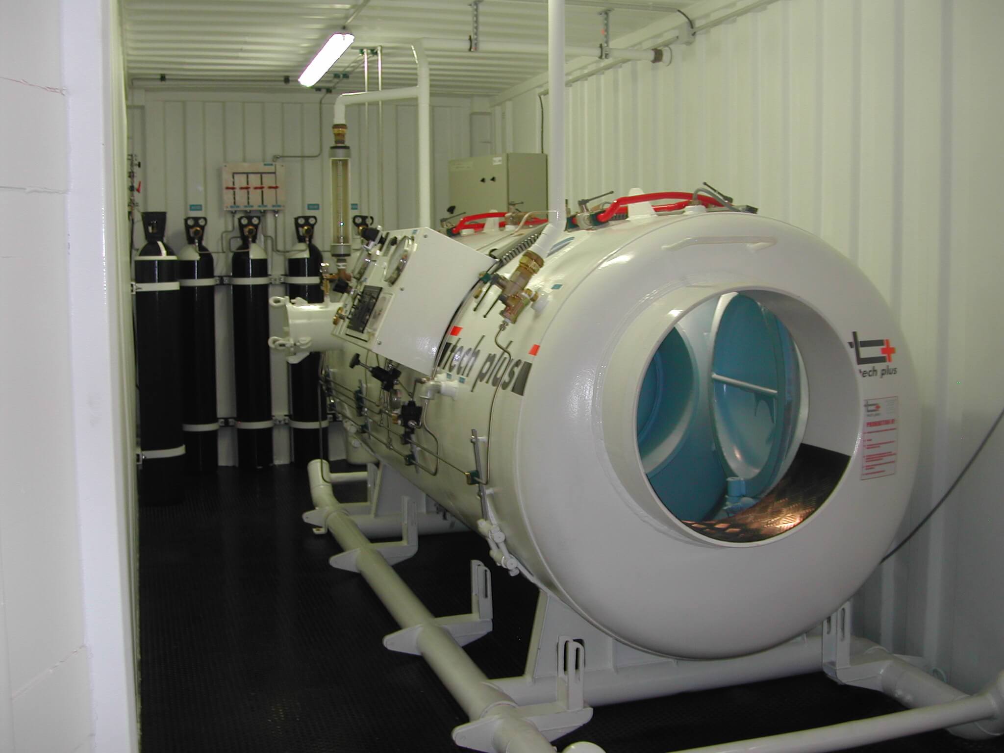 Portable hyperbaric chamber interior in shipping container for rental and lease services